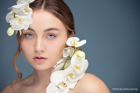 portrait headshot of woman with flowers