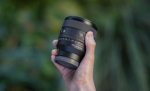 Sony FE 50mm f1.4 GM lens in photographers hand