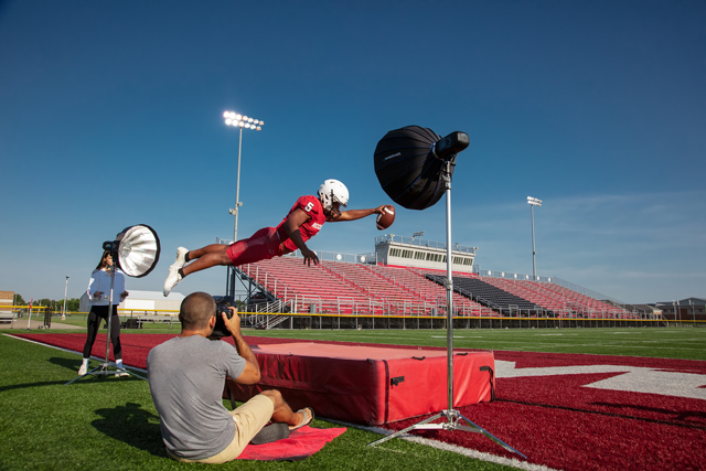 The Westcott FJ400 and FJ-X2M being used with photographer and football player 