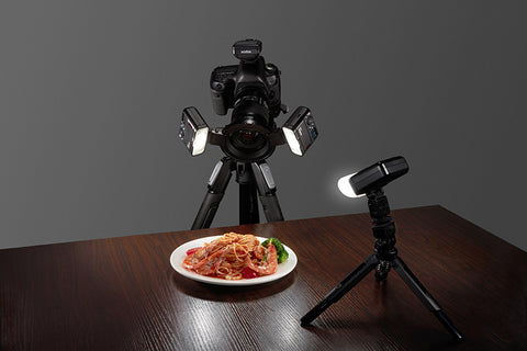 three godox MF12 flashes shining on a plate of food