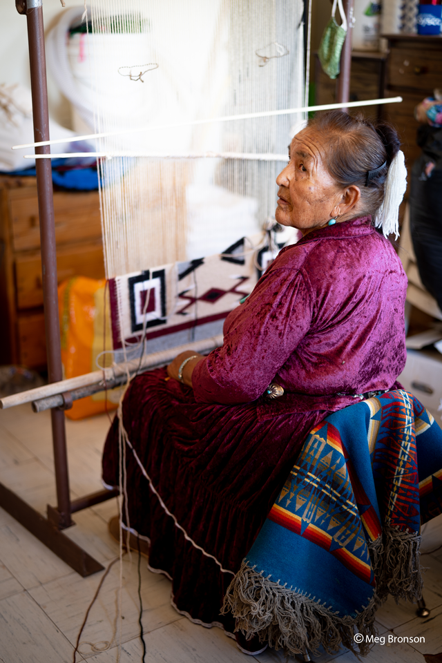 portrait of lady making a blanket for Navajo nation relief project