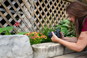 woman shooting macro in backyard