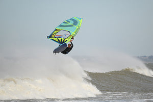 Wind Surfer jumping off a wave