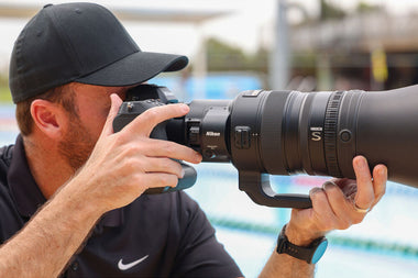 Photographer with Nikon 600mm TC VR S Lens