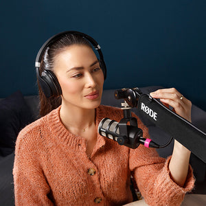 Woman recording podcast audio with RODE Podmic