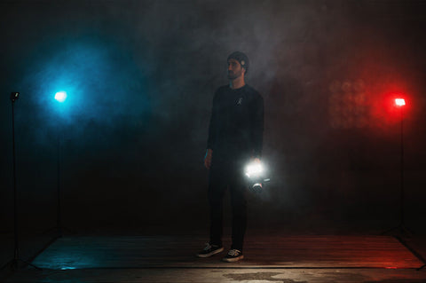 man standing in smokey room surrounded by lumecube RGB lights