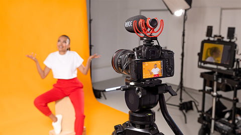 behind the scenes woman recording in a studio