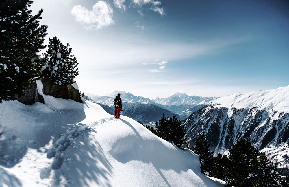 Photographer on snowy mountain 