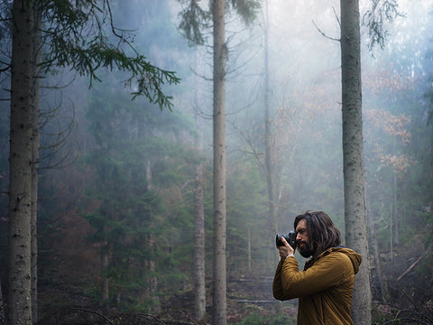 man in the forest with hasselblad camera