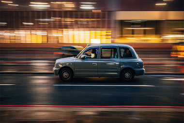 Motion blurred photo of car at night