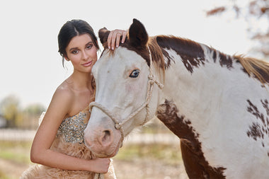 model posing with a horse
