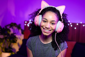 streamer with pink headphones on