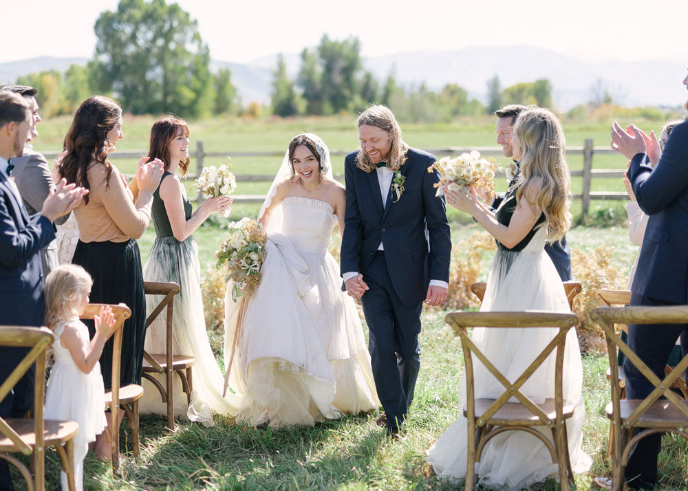 couple walking down the aisle taken by ashlee brooke 