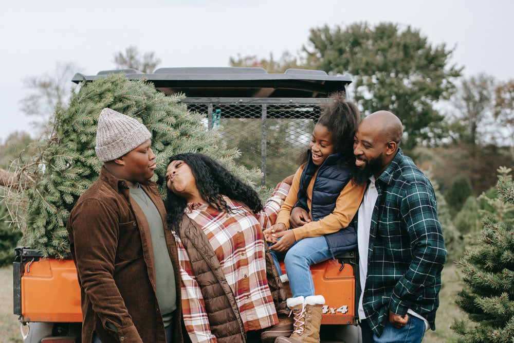 photo of mom trying to kiss son in family photo taken by any lane