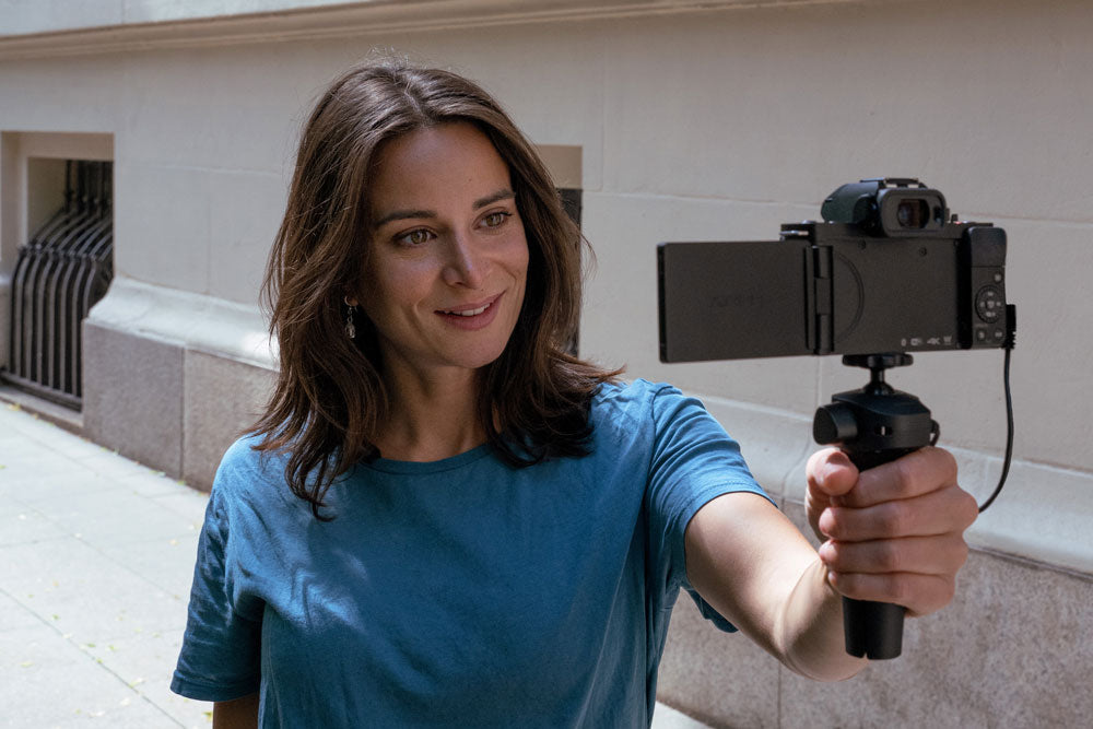 women using the panasonic lumic g100 to vlog