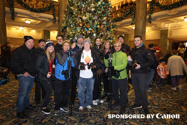 Group shot of the pictureline holiday photo walk attendees by christmas trees