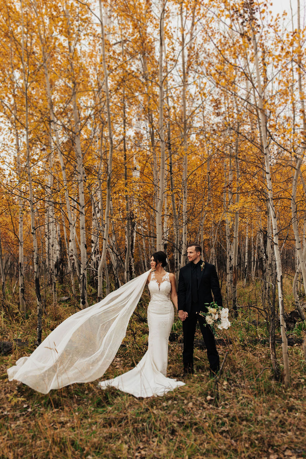 bride and groom in jackson hole taken by nicole aston