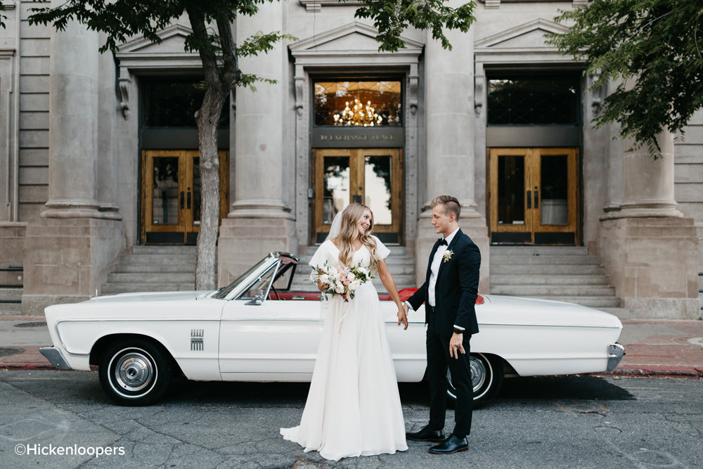 bride and groom by white car by scott hickenlooper
