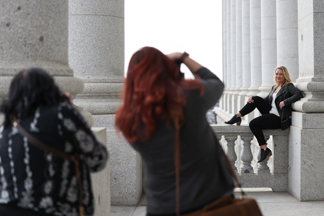 photographers taking photos of female model at the utah state capitol building
