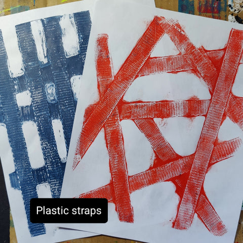 Papers created on a gel printing plate using plastic straps and acrylic paint.