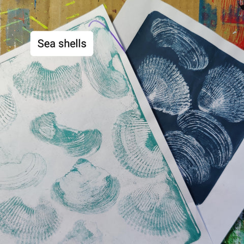 Papers created on a gel printing plate using sea shells and acrylic paint.