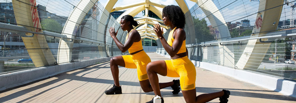 Two young african american women doing aerobic exercises