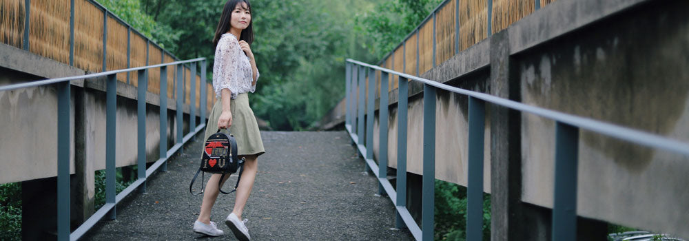 Young asian woman walking up a walkway