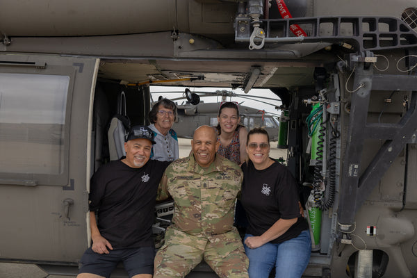 Darrell Jones and His Family Sitting in a Helicopter on Base