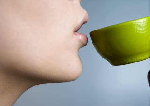 a woman about to drink tea