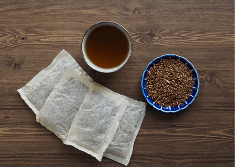 a cup of hot roasted barley tea with teabags