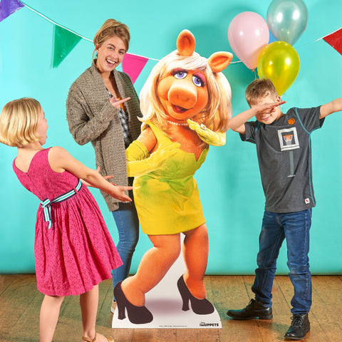Miss Piggy cardboard cutout in room with fans
