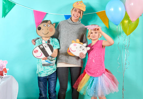 children wearing peppa pig masks