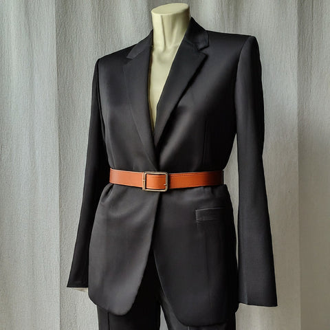 Women's black dress suit paired with brown belt