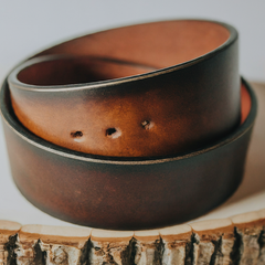 An image featuring a vintage-style leather belt with a slightly worn appearance, showcasing the unique character of distressed leather.