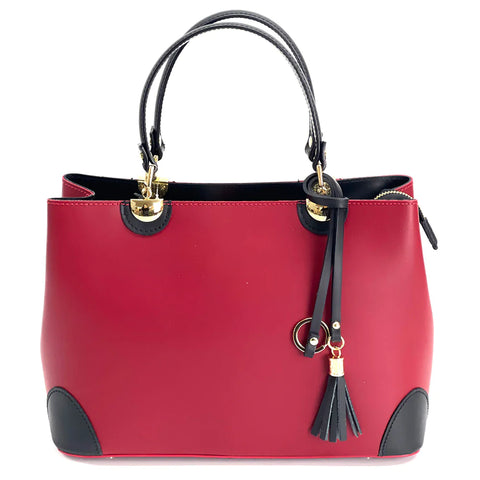 Red leather tote bag with black tassel