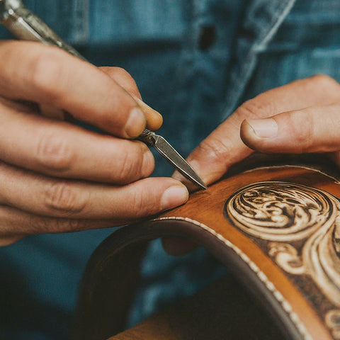 Image of a Western Buckle Craftsman Working on Engraving