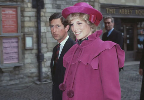 Princess Diana stake centre stage with her crimson hat and matching dress