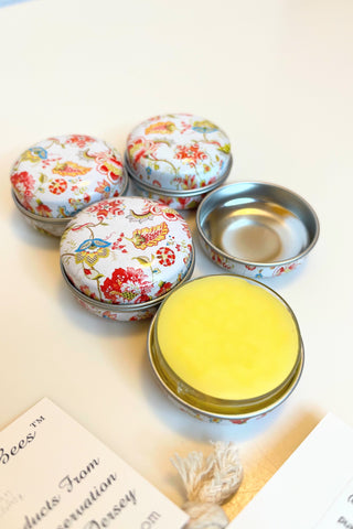 decorated tins of handcrafted natural beeswax lip balm