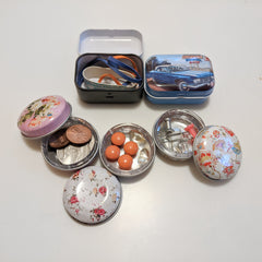 reusable tins with coins, pills, paper clips, tacks, rubber bands, etc.