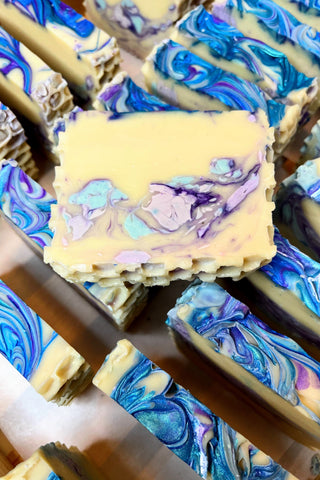 Rosemary soap with swirls of mineral mica in celest, dark blue and purple.