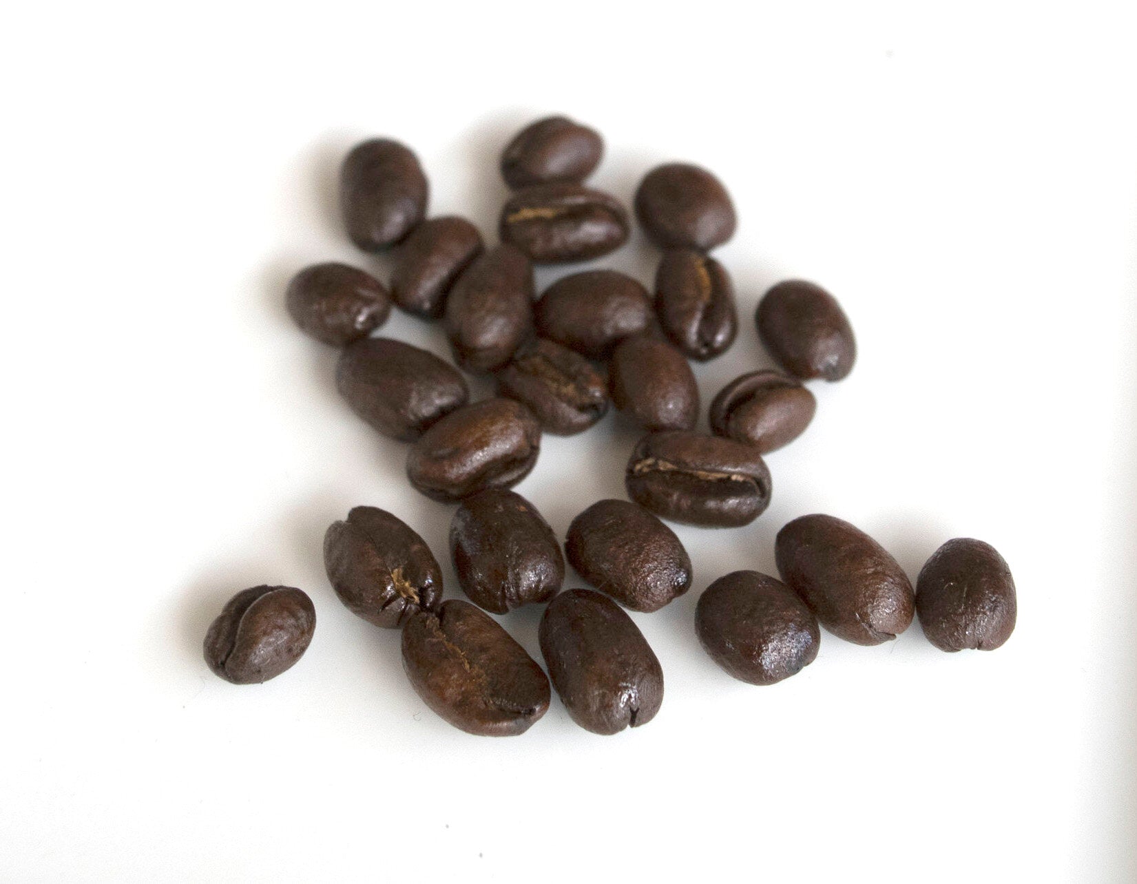 Peaberry is a classification of coffee beans that, through an anomaly in the growing process, only has one bean developed within the coffee cherry. PHOTO: Dayva Keolanui