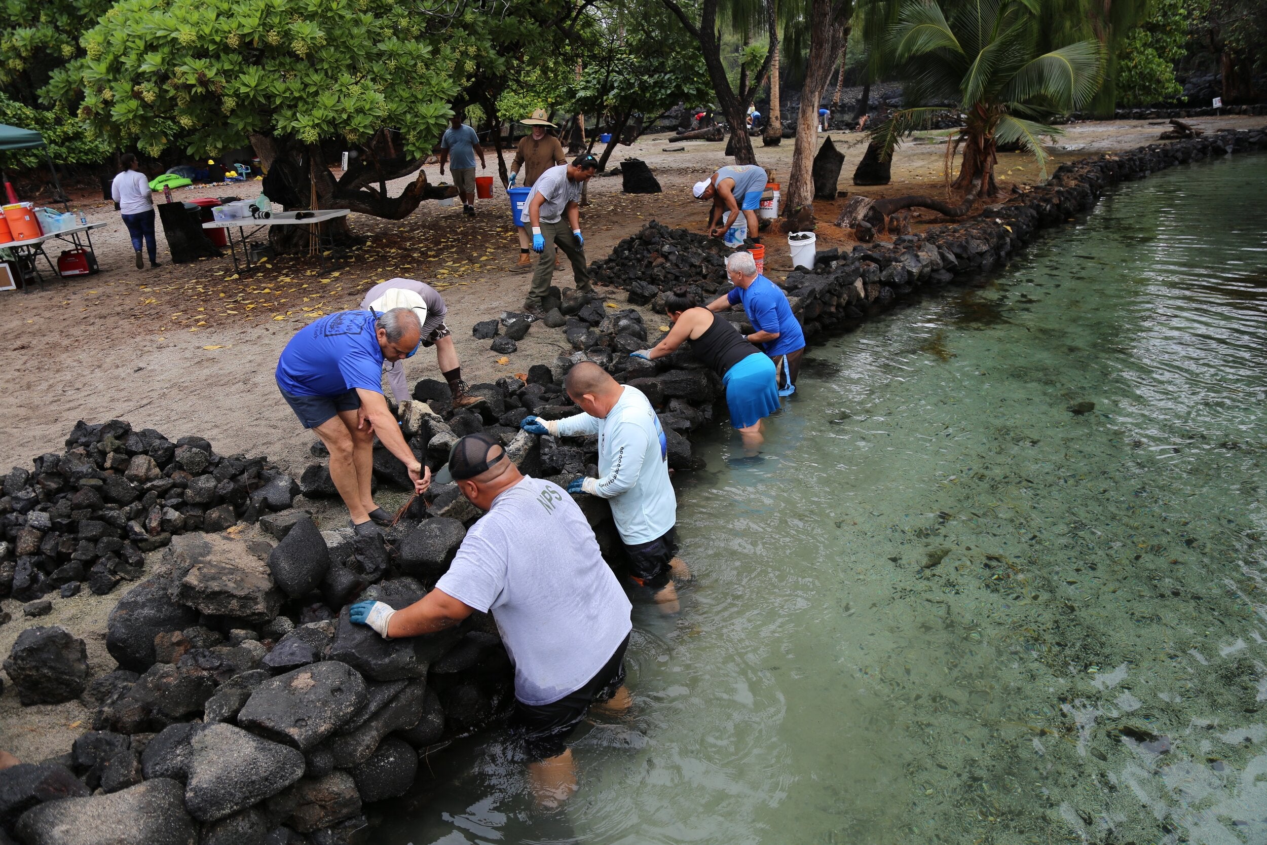 Volunteers help to rebuild walls at Ka Loko o Kīholo (fishpond) at a monthly workday with The Nature Conservancy. PHOTO: Hui Aloha Kīholo