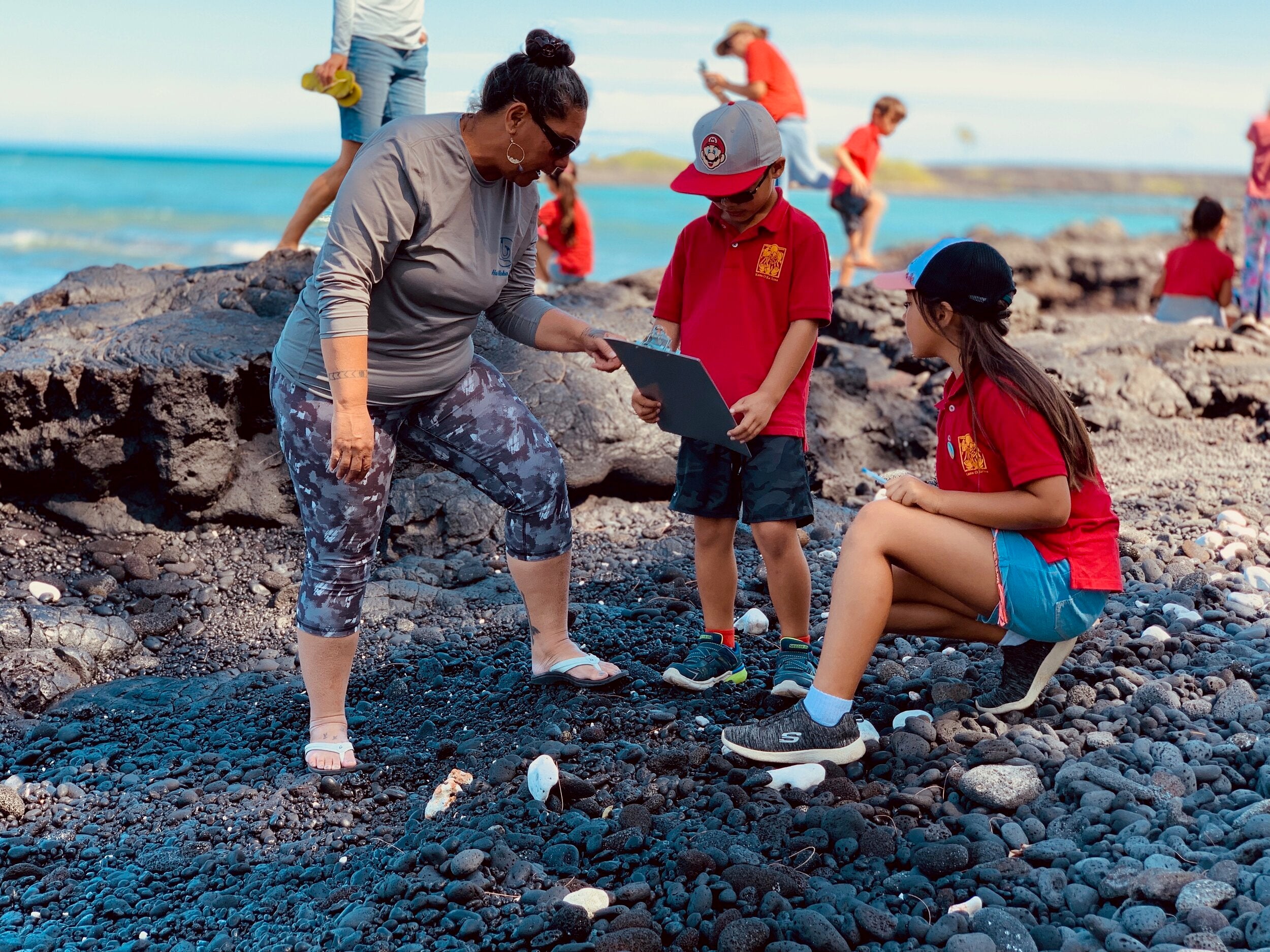 Hui Aloha Kīholo’s Cultural Director, Kuʻulei Keakealani facilitates a school excursion with students. PHOTO: Hui Aloha Kīholo