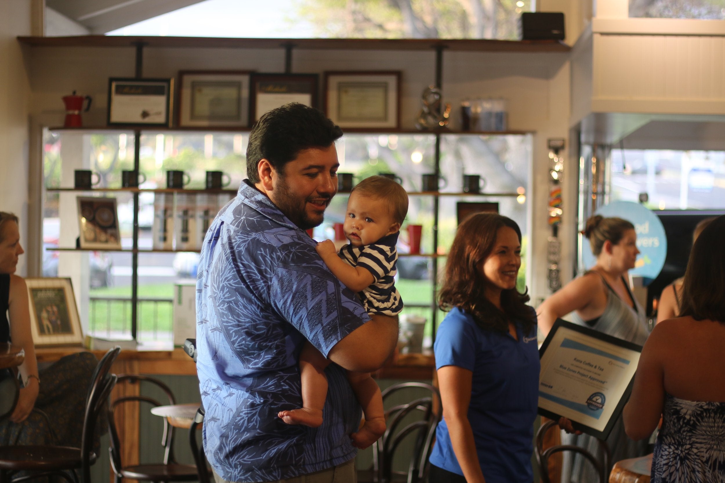 T. Ilihia Gionson and his daughter Kawaipōmaikaʻi at the Blue Zones launch party at Kona Coffee &amp; Tea. PHOTO: Chance Ortiz