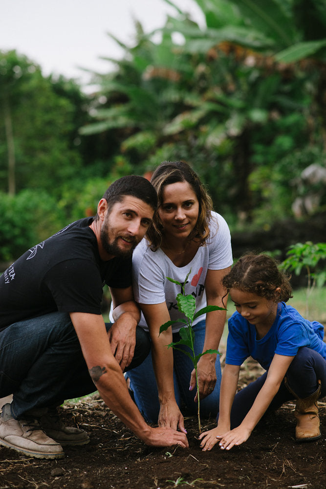 Danny, planting coffee with his wife and daughter. PHOTO: Blake Wisz