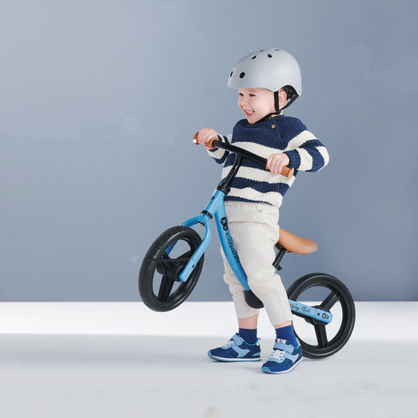 A Kid with his Kinderkraft Balance Bike 2WAY NEXT