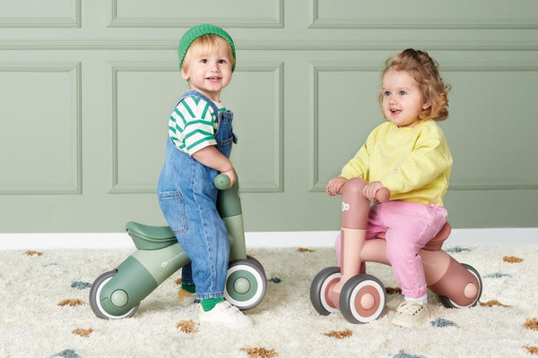 Two Kids with their Kinderkraft Balance Bikes MINIBI