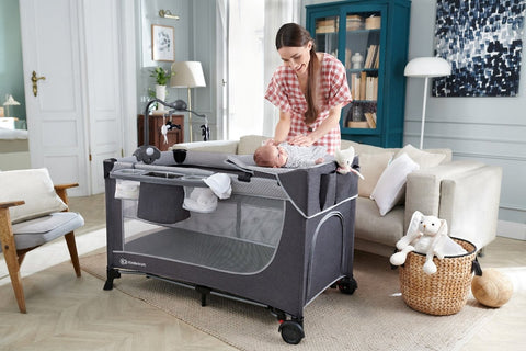 Kinderkraft Travel Cot LEODY in home setting with mother and baby