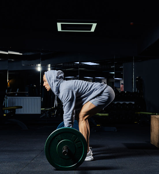 man in gym deadlifting