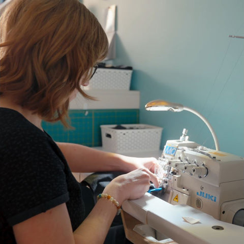 sewing garments in the Pure Colour Baby studio